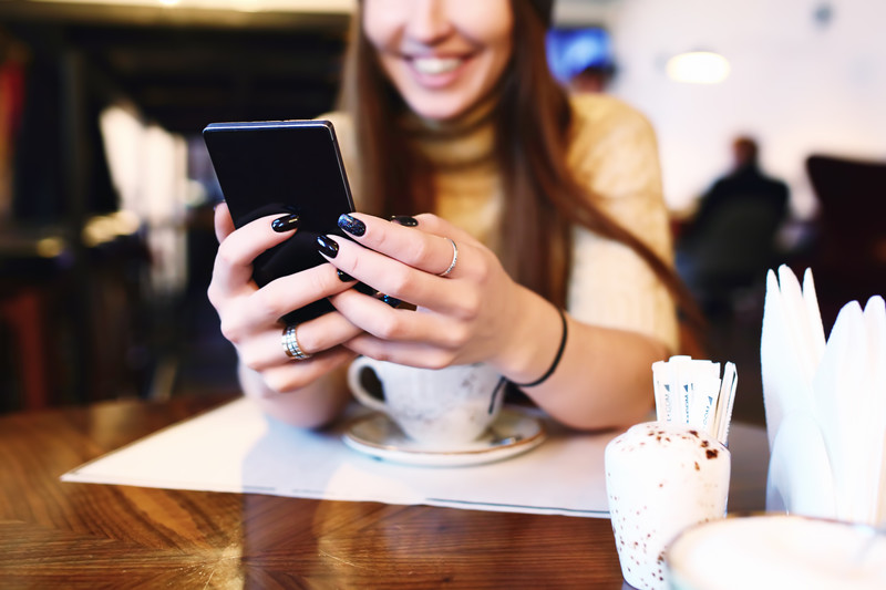 Woman on phone in cafe